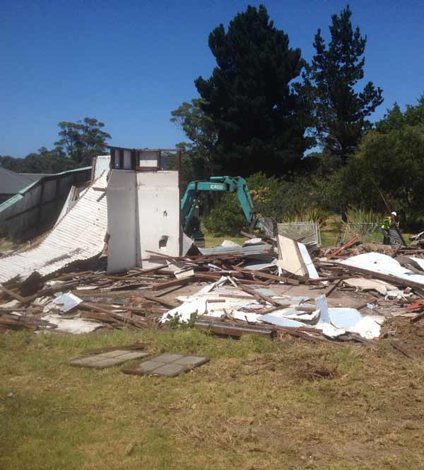 Photo of the the remains of a building while being demolished by CCS