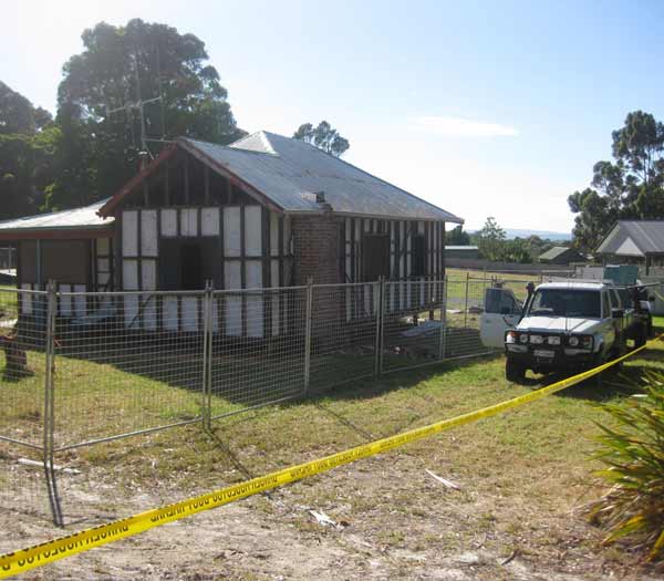 Photo overlooking a house before it is demolished